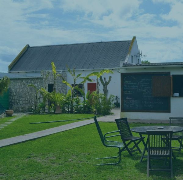 Wide view of The Plot gardens and venue buildings in Jacobsbaai